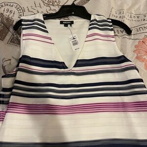 Sundress, sleeveless, lightweight, and casual and elegant.